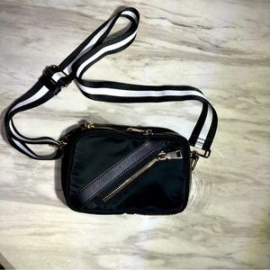 Sol and Selene black accolade sling backpack gold accent convertible and vegan